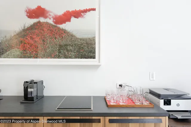 a bedroom with a bed and a large mirror