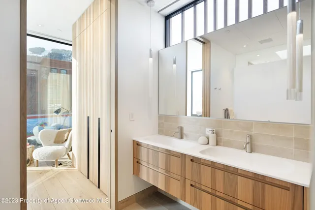 a bathroom with a sink vanity and a mirror