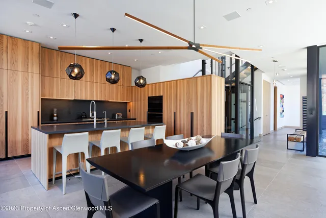 a kitchen with a table and chairs