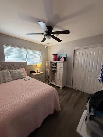 a spacious bedroom with a bed and a walk in closet