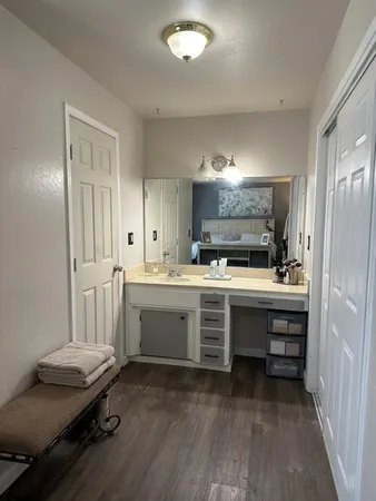 a kitchen with a sink appliances and cabinets