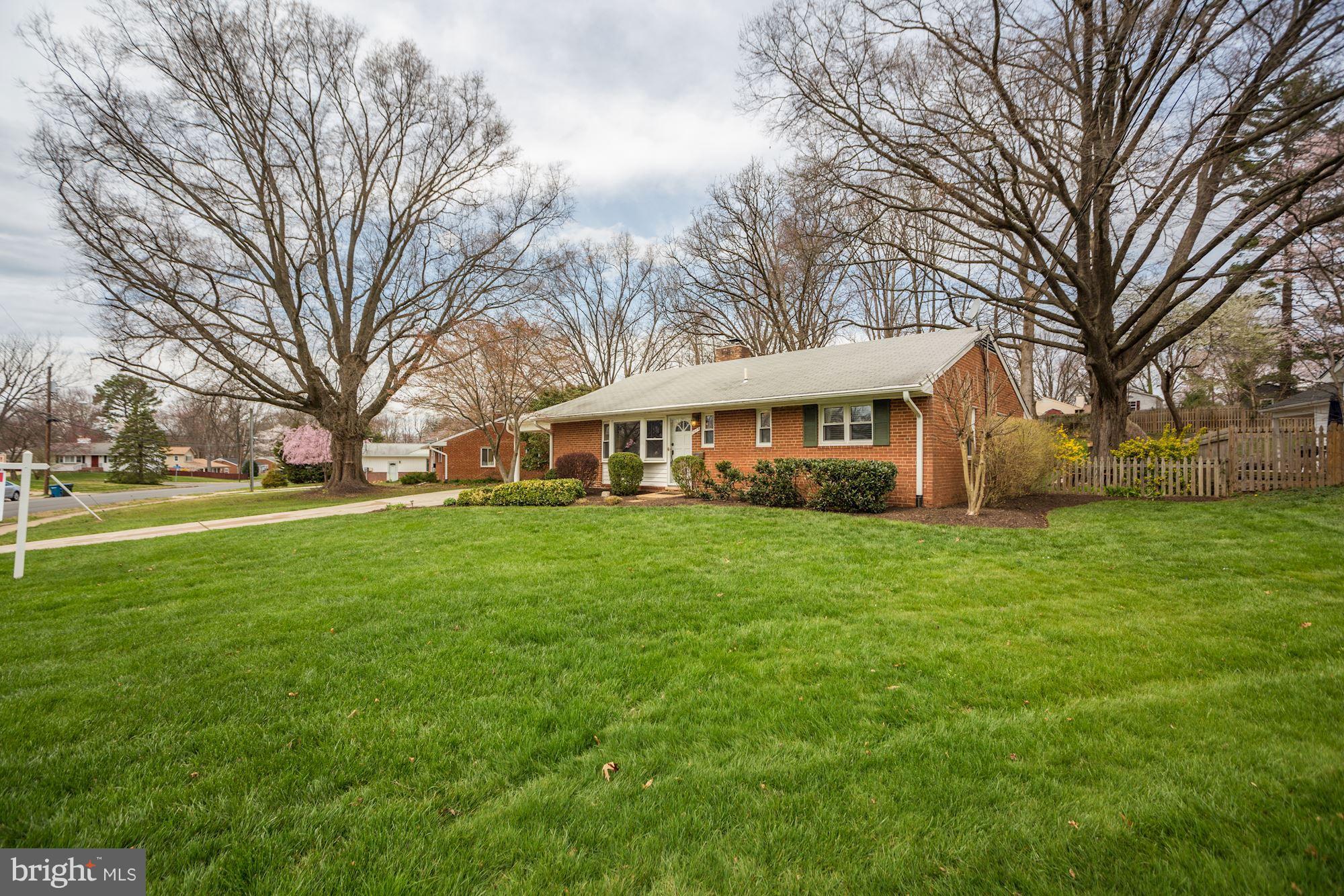 7414 Axton Street Springfield, VA 22151 - Photo 2 of 30 a front view of a house with a garden