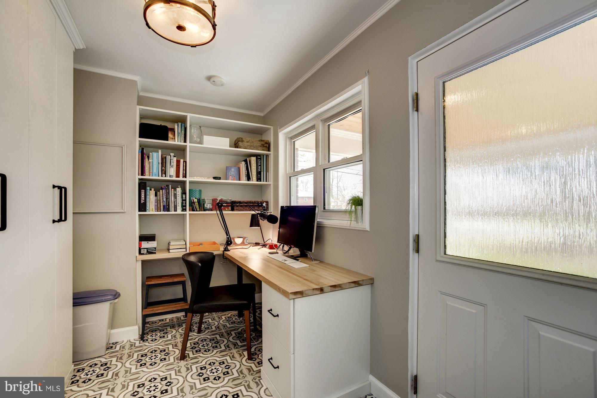 7414 Axton Street Springfield, VA 22151 - Photo 13 of 30 a view of a workspace with furniture and a window