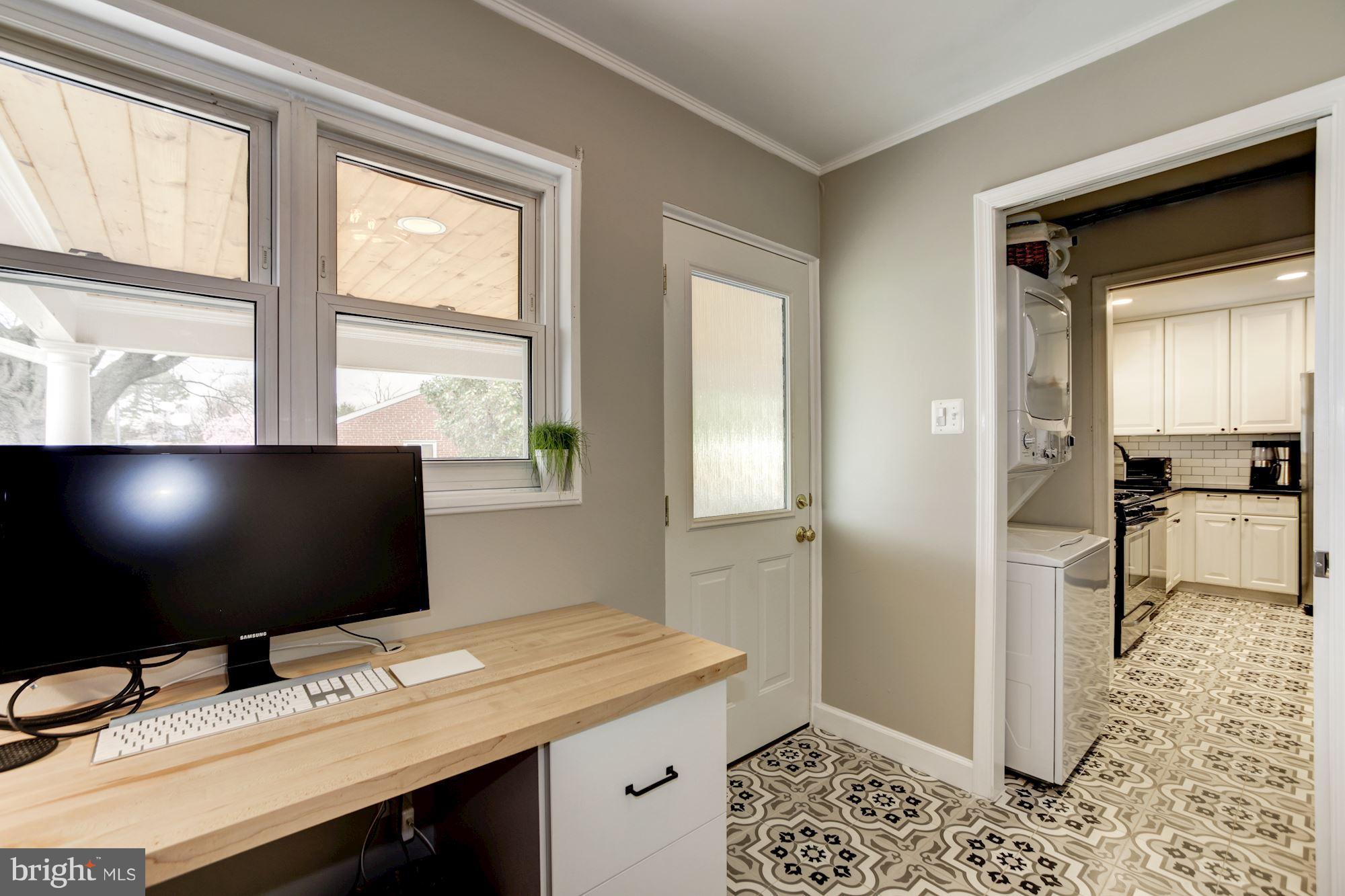 7414 Axton Street Springfield, VA 22151 - Photo 14 of 30 a view of a workspace with furniture and a window