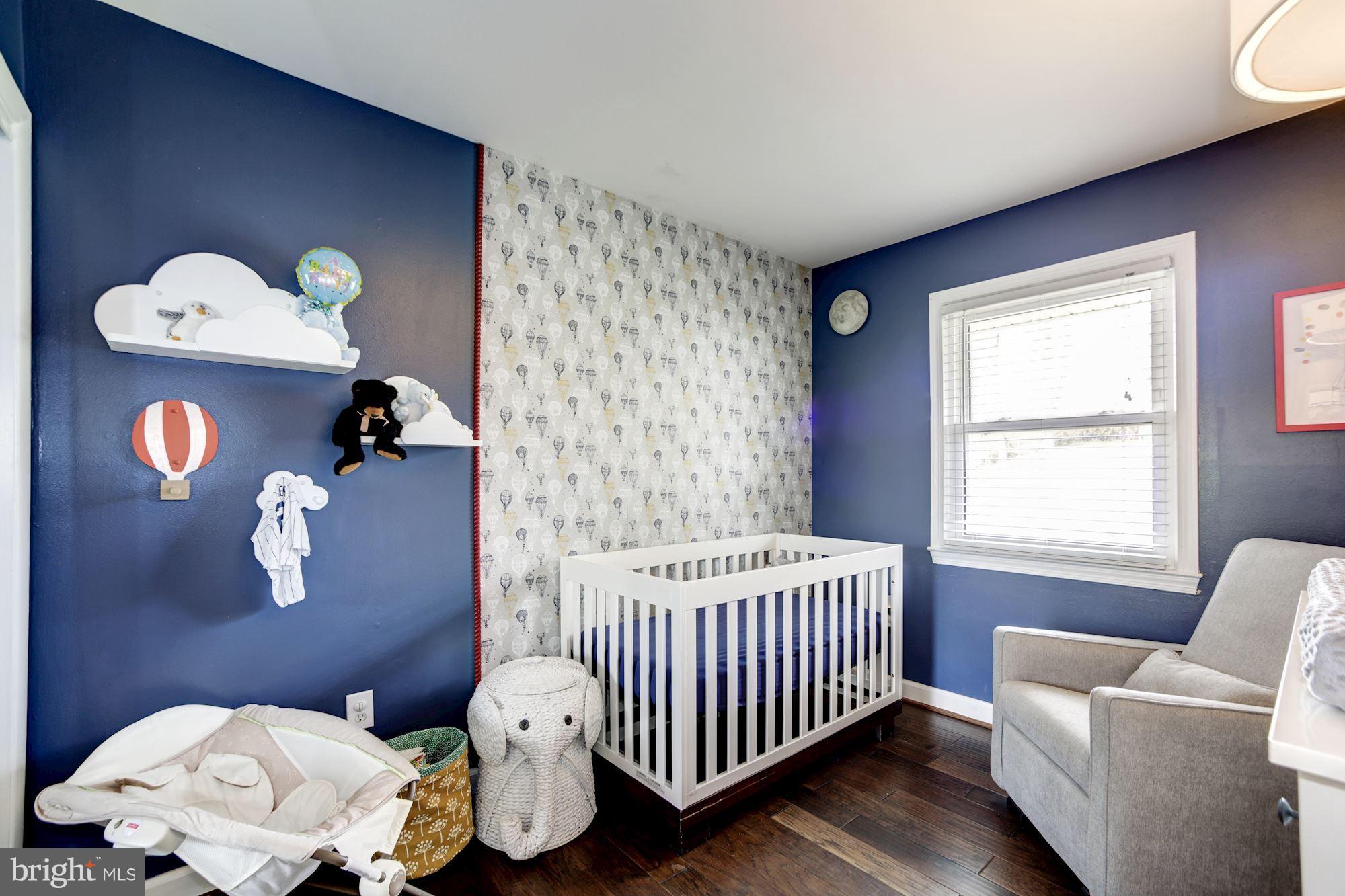 7414 Axton Street Springfield, VA 22151 - Photo 20 of 30 a bedroom with a bed and a window