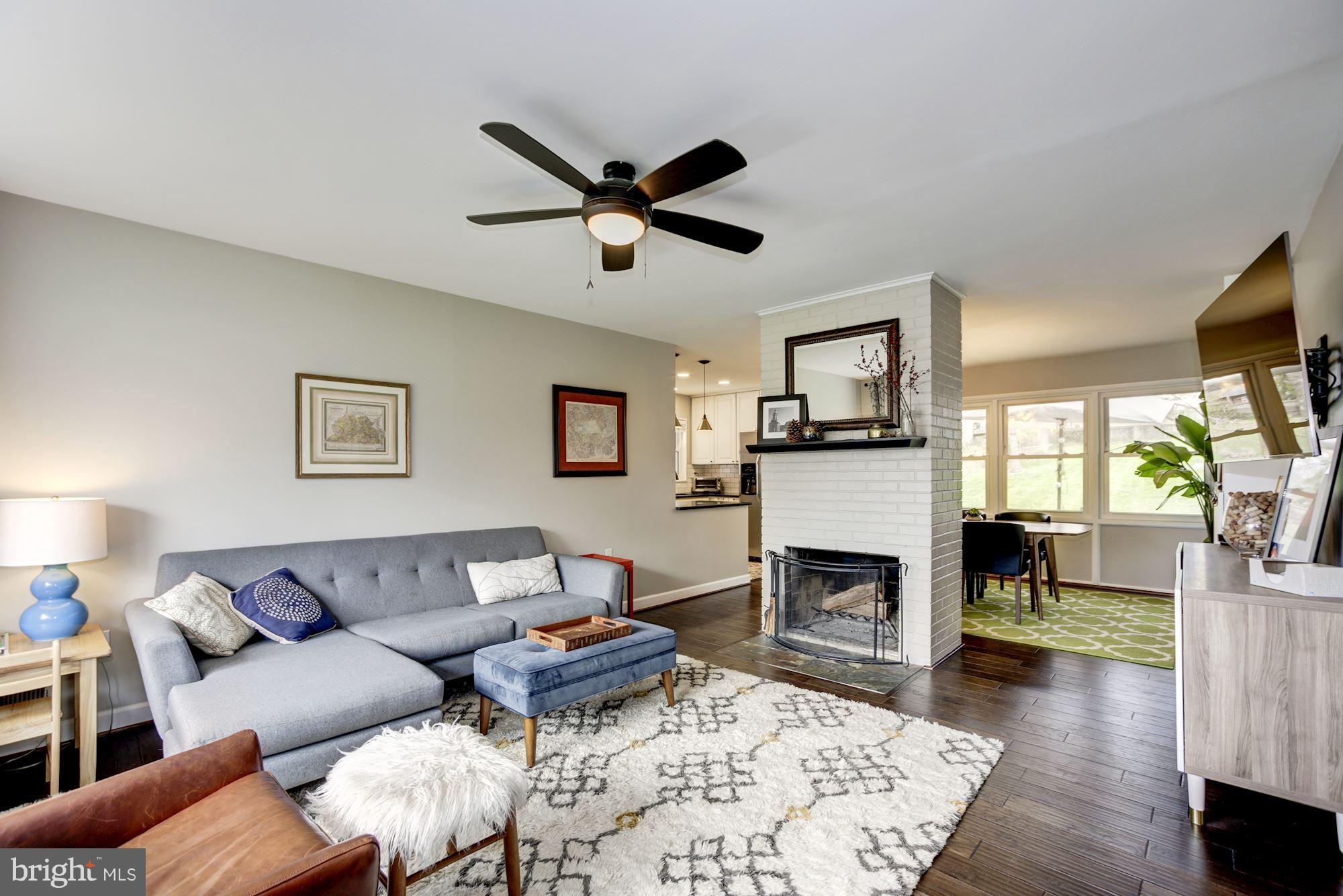 7414 Axton Street Springfield, VA 22151 - Photo 4 of 30 a living room with furniture and a fireplace