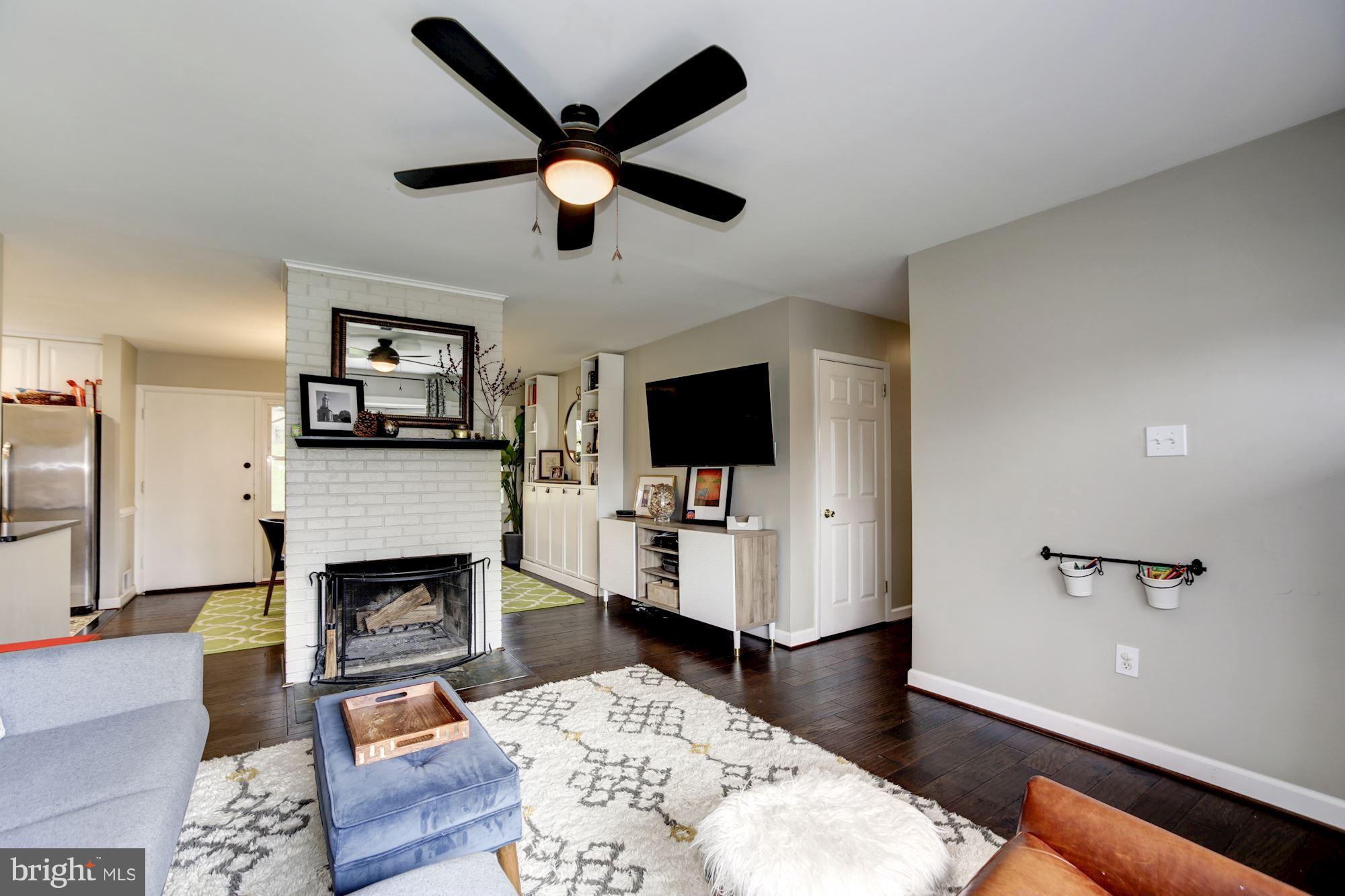 7414 Axton Street Springfield, VA 22151 - Photo 6 of 30 a living room with furniture and a flat screen tv