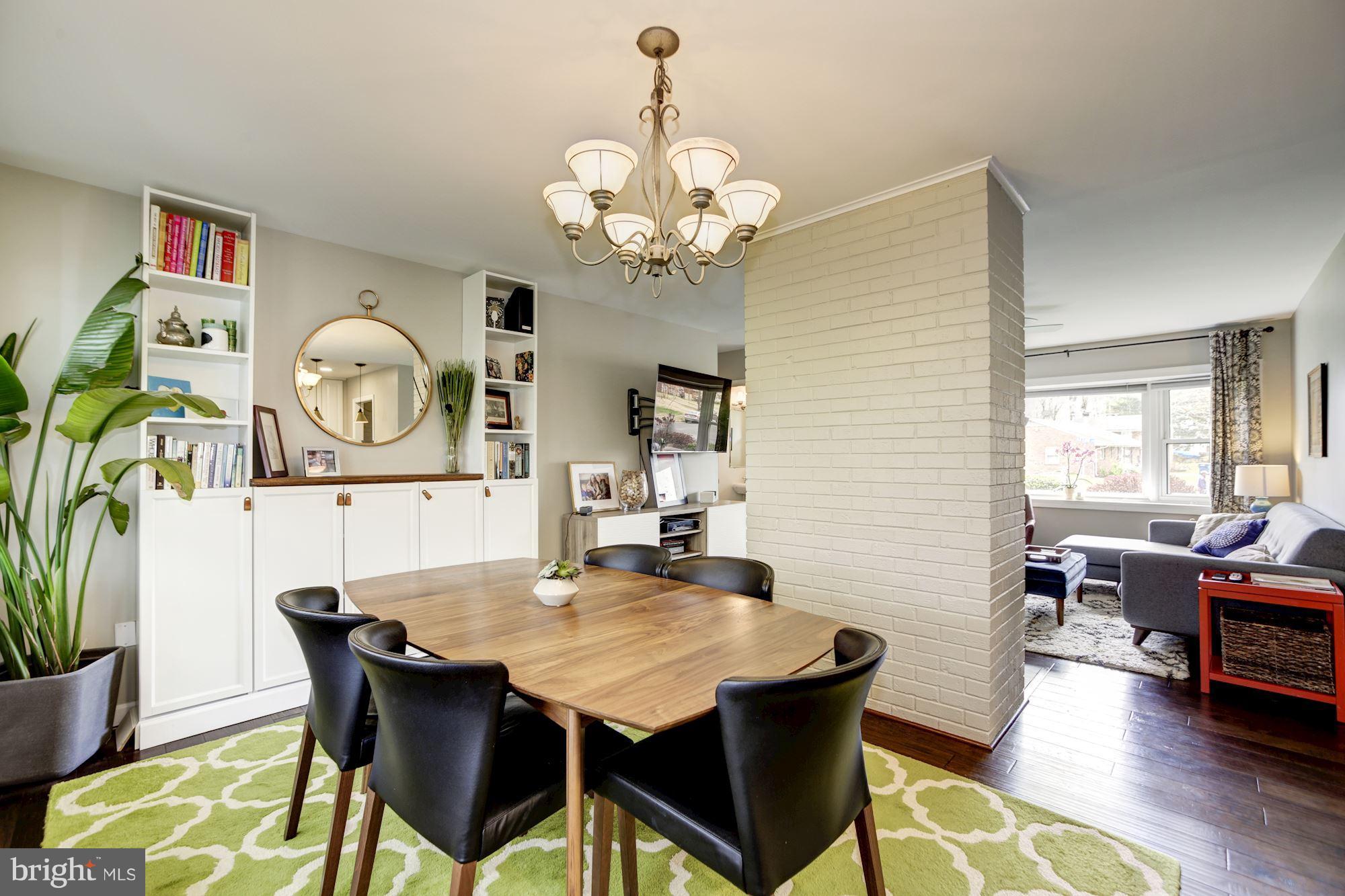 7414 Axton Street Springfield, VA 22151 - Photo 8 of 30 a view of a dining room with furniture and wooden floor