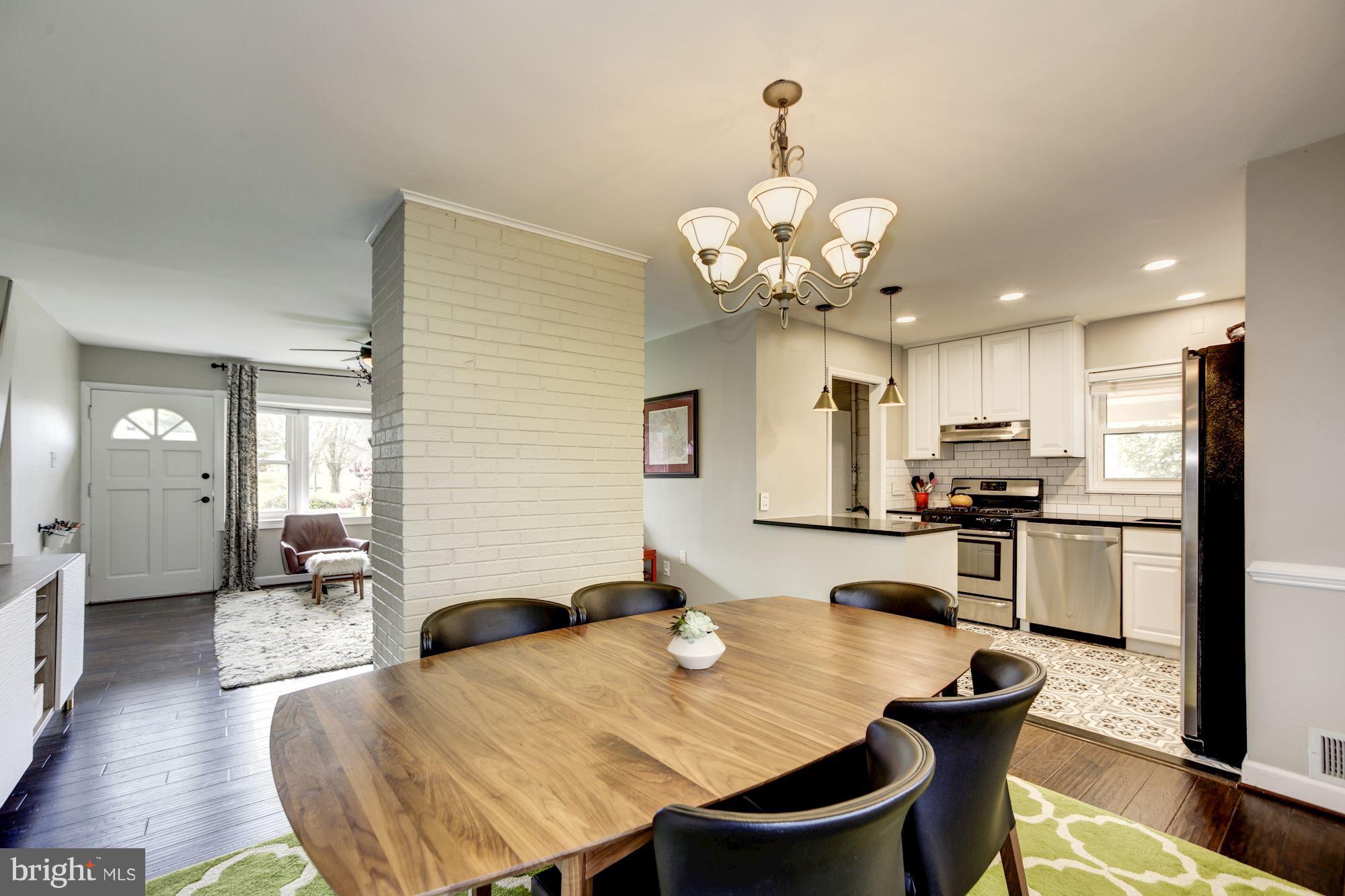 7414 Axton Street Springfield, VA 22151 - Photo 9 of 30 a large kitchen with a table and chairs