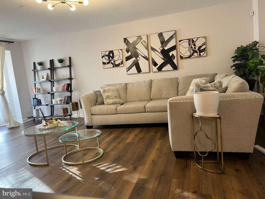 3650 Marcey Creek Road Laurel, MD 20724 - Photo 2 of 10 a living room with furniture and wooden floor