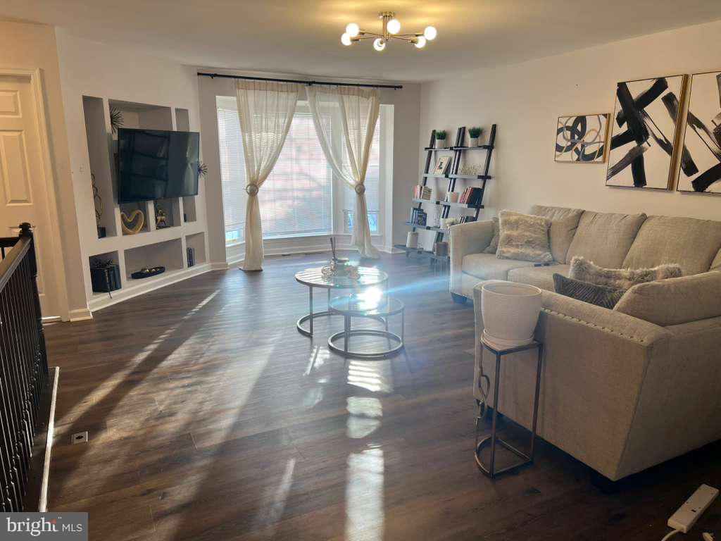 3650 Marcey Creek Road Laurel, MD 20724 - Photo 6 of 10 a living room with couches and a flat screen tv