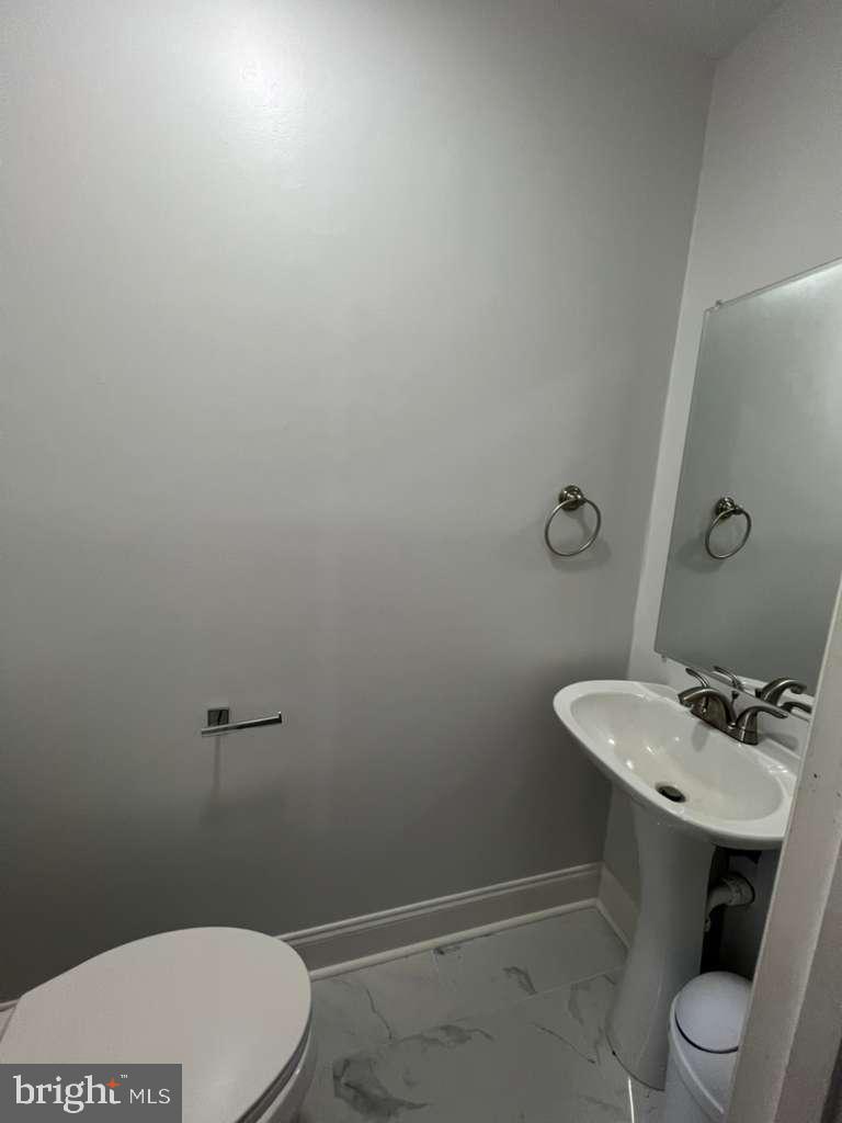 3650 Marcey Creek Road Laurel, MD 20724 - Photo 10 of 10 a bathroom with a sink a toilet and mirror