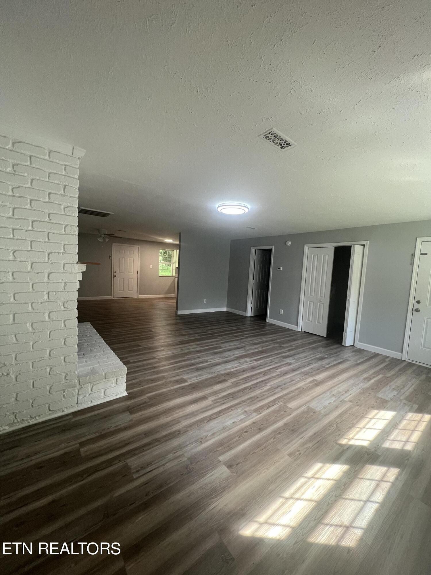 5710 Hyatt Road Knoxville, TN 37918 - Photo 2 of 19 a view of empty room with wooden floor