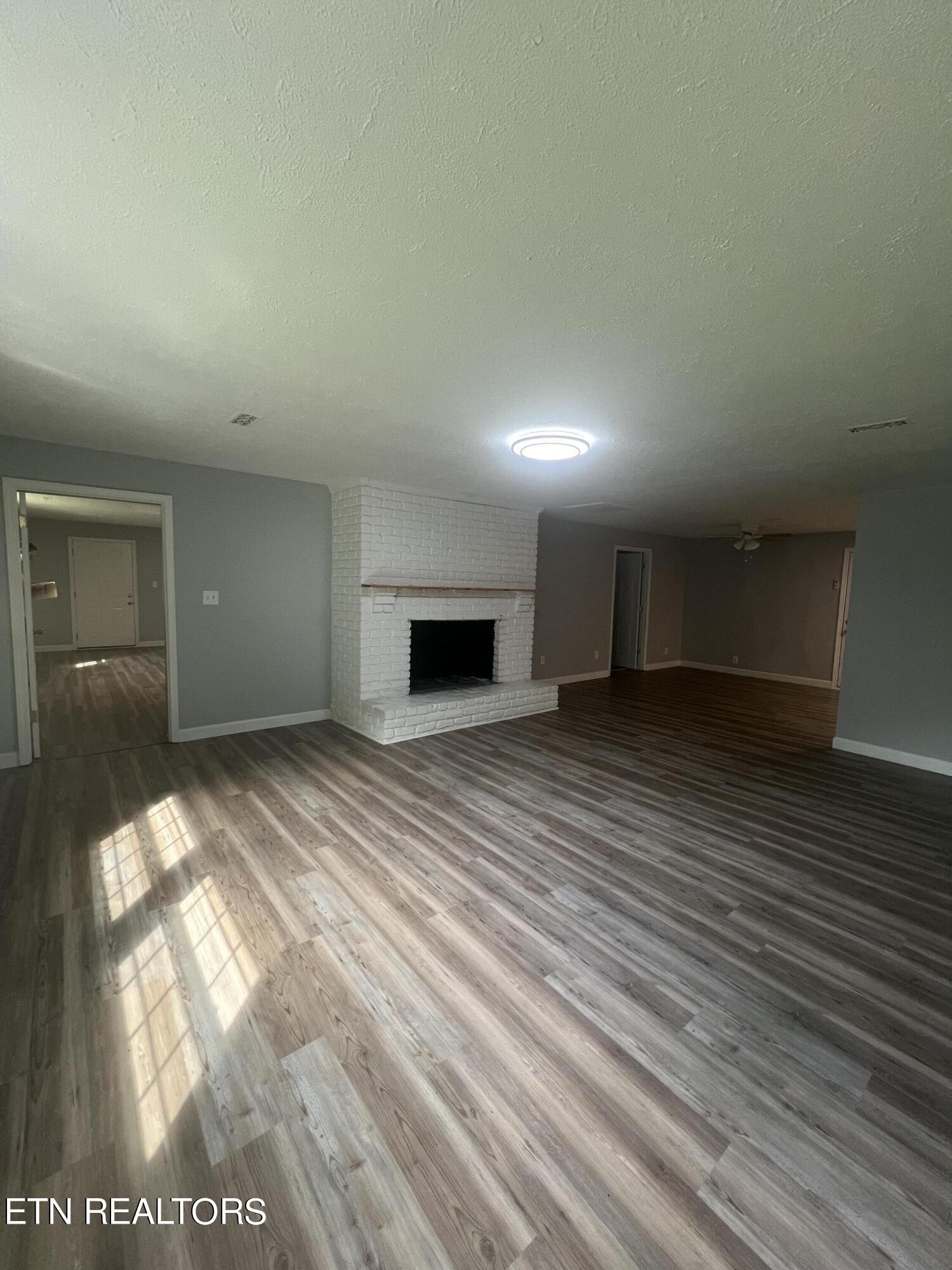 5710 Hyatt Road Knoxville, TN 37918 - Photo 3 of 19 a view of empty room with wooden floor