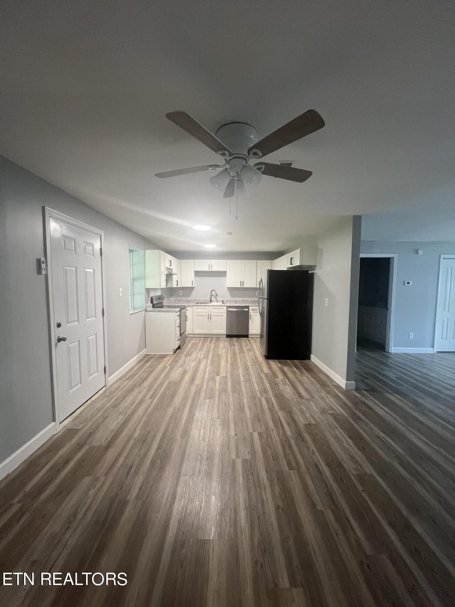 5710 Hyatt Road Knoxville, TN 37918 - Photo 4 of 19 a view of a room with wooden floor