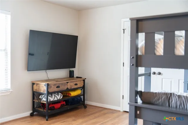 a room with furniture and flat screen tv