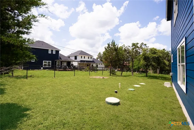 a view of a playground with basketball court