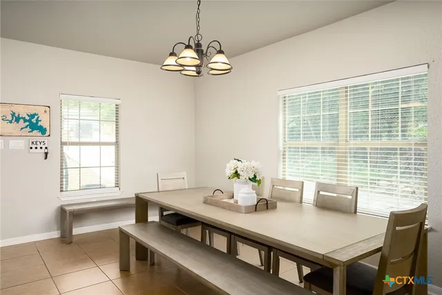 a view of a dining room with furniture window and outside view