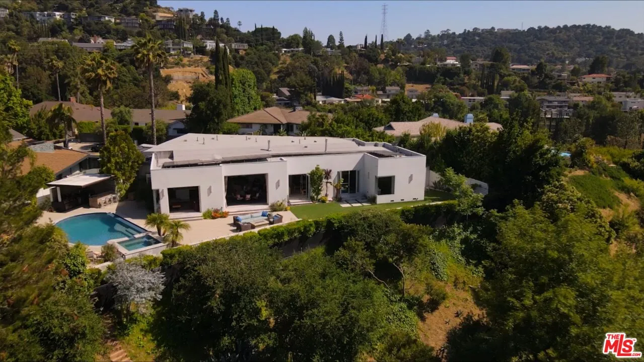 a aerial view of a house with a yard