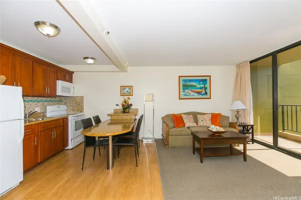 a living room with furniture a rug and a table