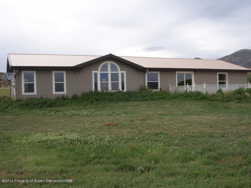 3360 County Road 233 Rifle, CO 81650 - Photo 3 of 33 a front view of a house with yard