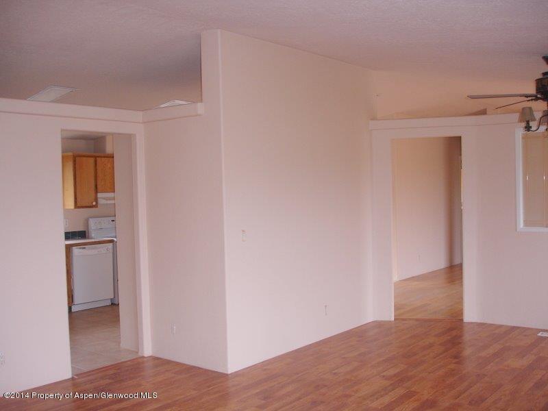 3360 County Road 233 Rifle, CO 81650 - Photo 8 of 33 a view of hallway with a sink and a refrigerator
