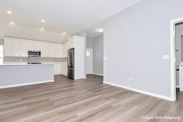a view of kitchen with wooden floor