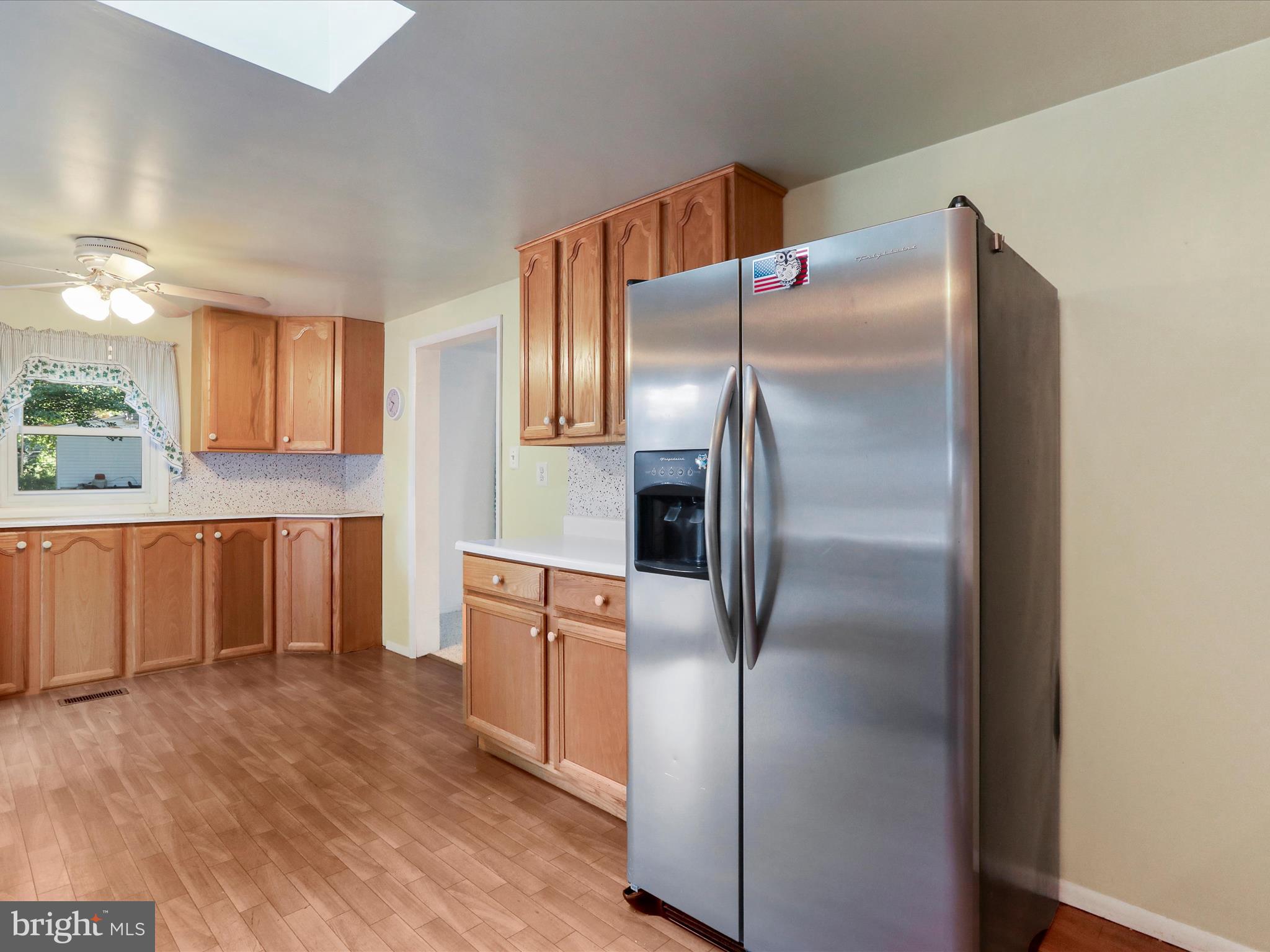 18540 Brooke Road Sandy Spring, MD 20860 - Photo 11 of 39 a kitchen with stainless steel appliances granite countertop a refrigerator and a stove top oven