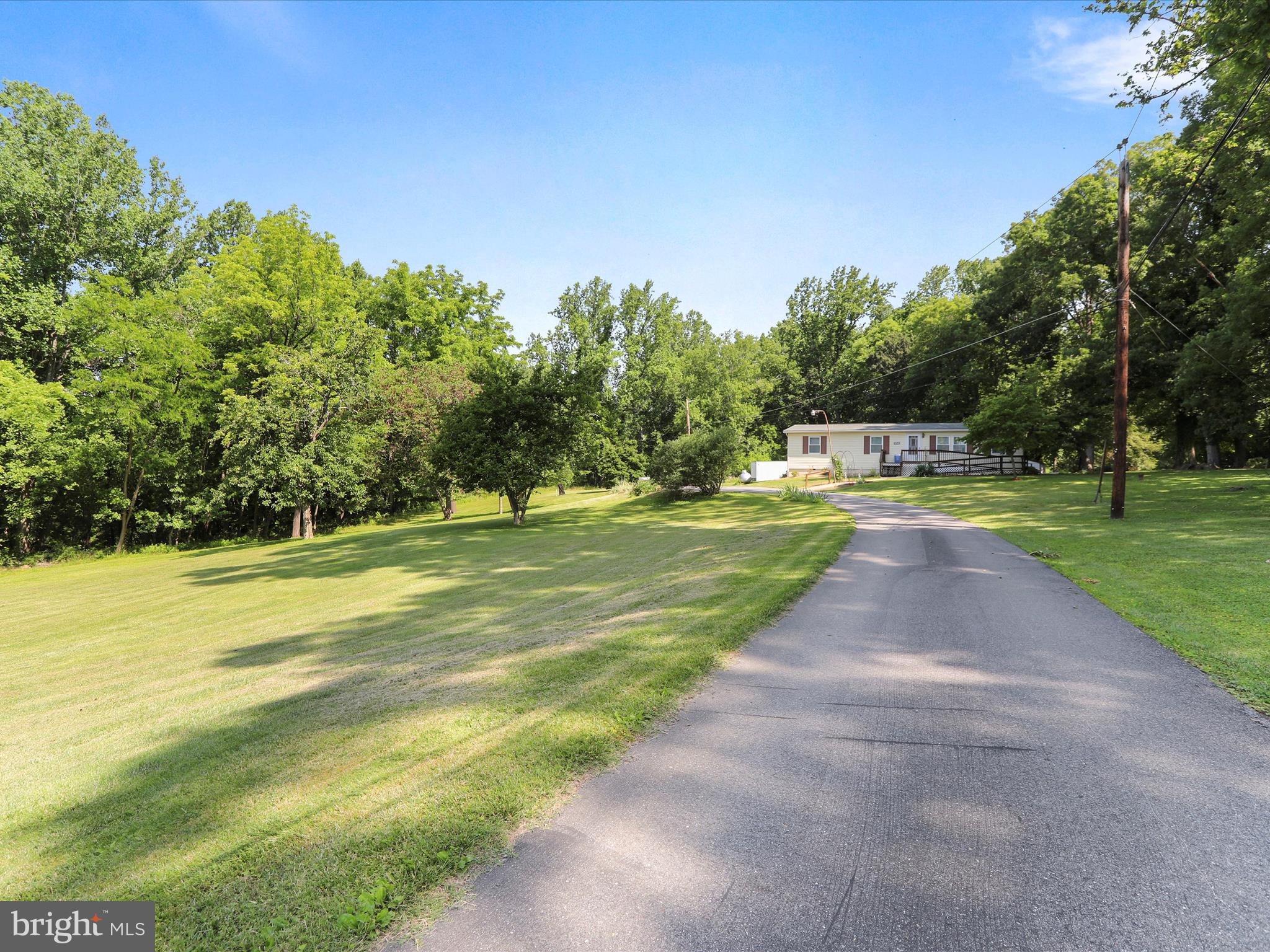 18540 Brooke Road Sandy Spring, MD 20860 - Photo 39 of 39 a view of a swimming pool with a yard