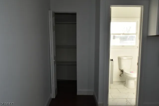 a view of a bathroom from a corridor