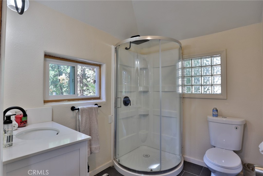 2548 Secret Drive Running Springs, CA 92382 - Photo 12 of 24 a bathroom with a sink toilet and shower