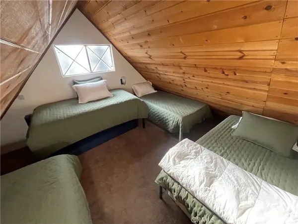 a view of a bedroom from a hallway