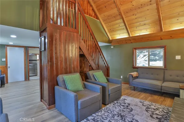a living room with furniture and a rug