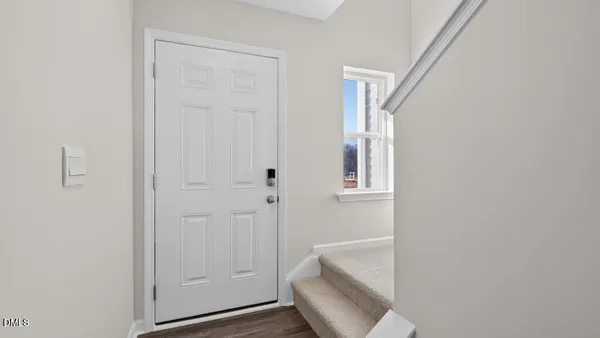 a view of a hallway with staircase