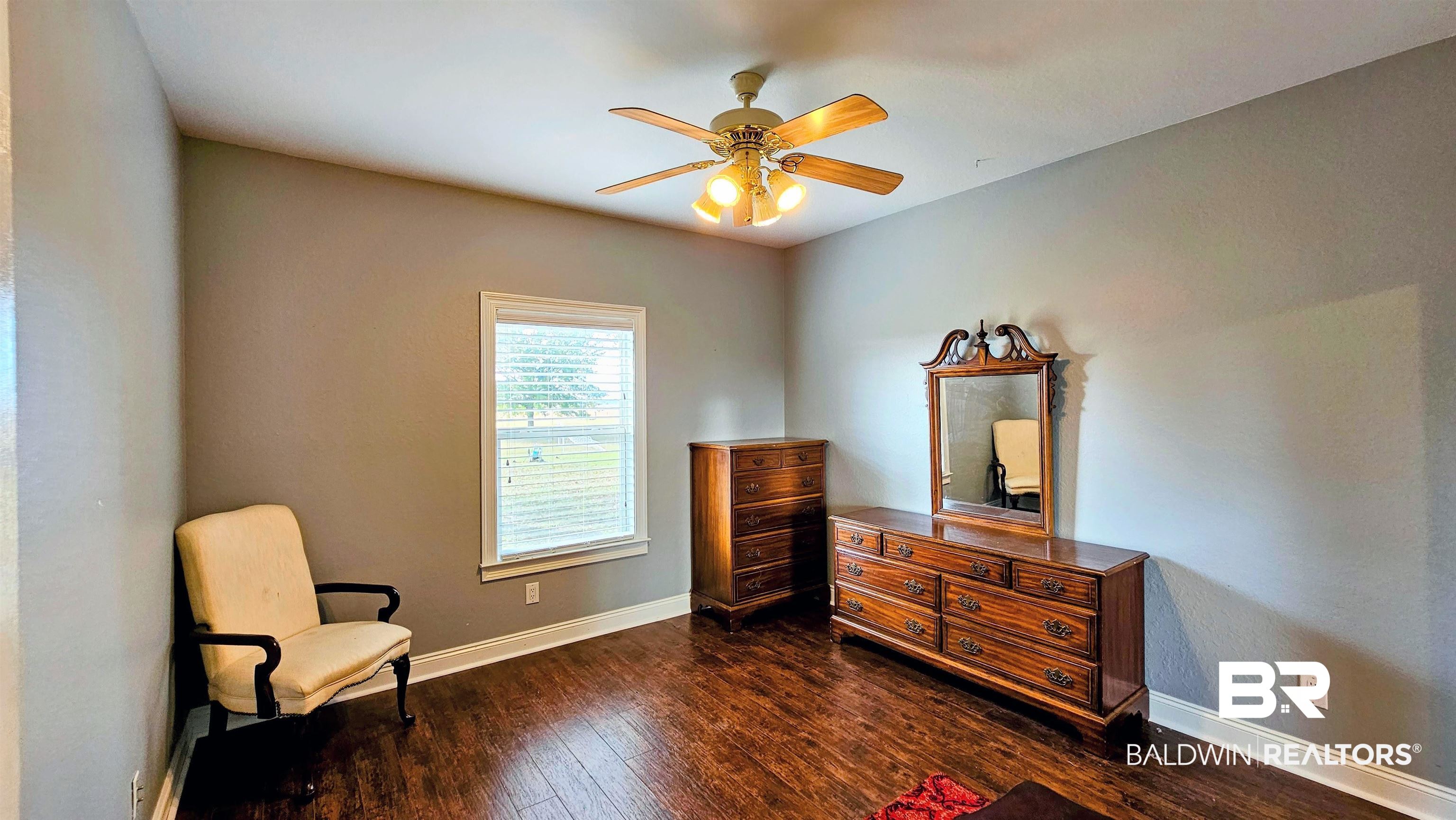 9275 Crawford Road Elberta, AL 36530 - Photo 27 of 28 Bedroom featuring dark wood finished floors and ceiling fan