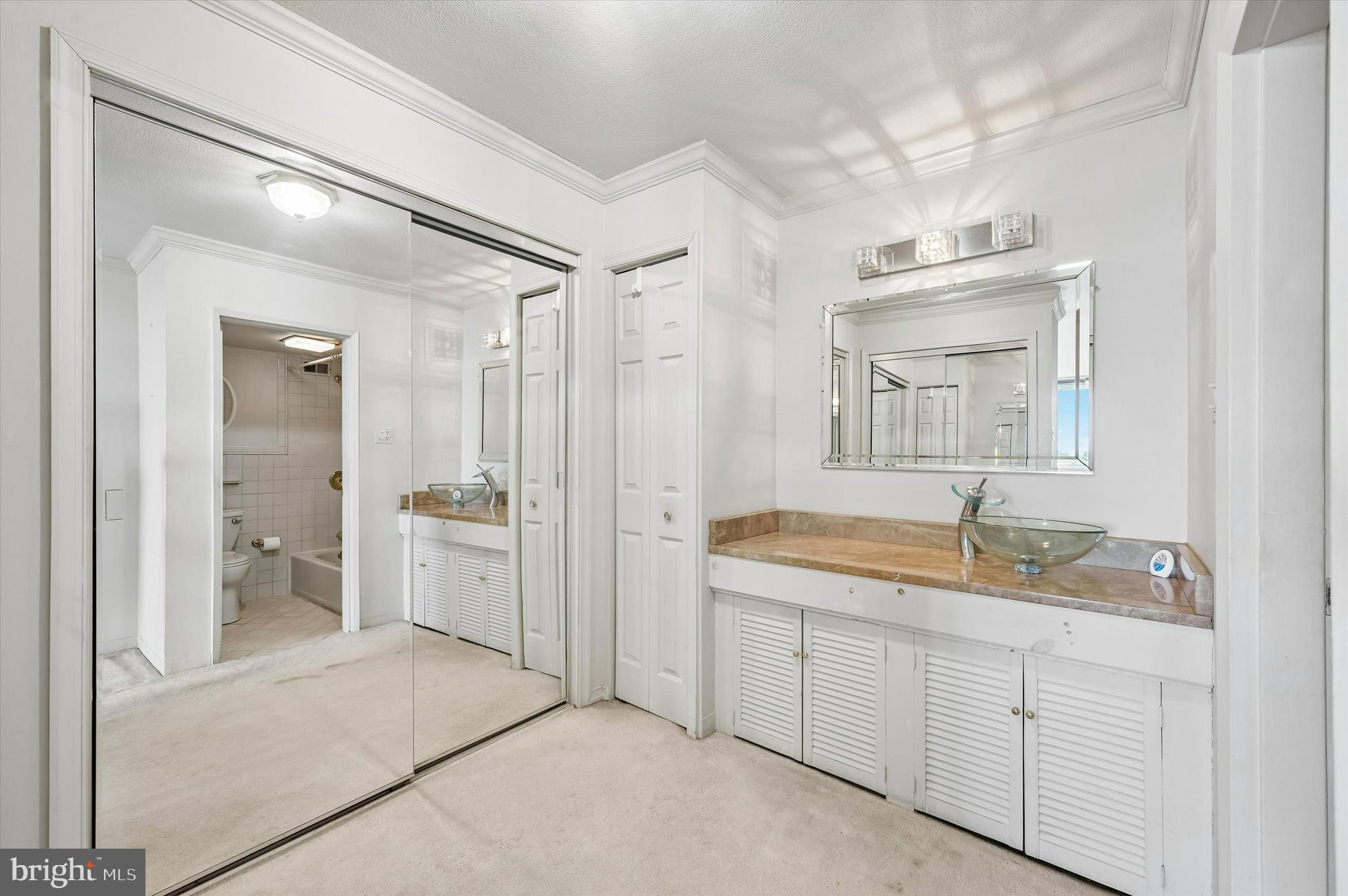 3900 West Ford Road, Unit 16E Philadelphia, PA 19131 - Photo 9 of 14 Walk in Closet and Bathroom