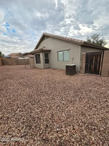 a small white house with a outdoor space
