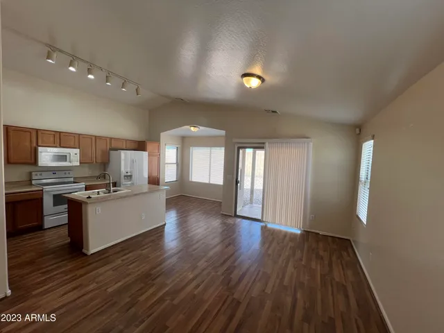 a view of kitchen with sink and wooden floor