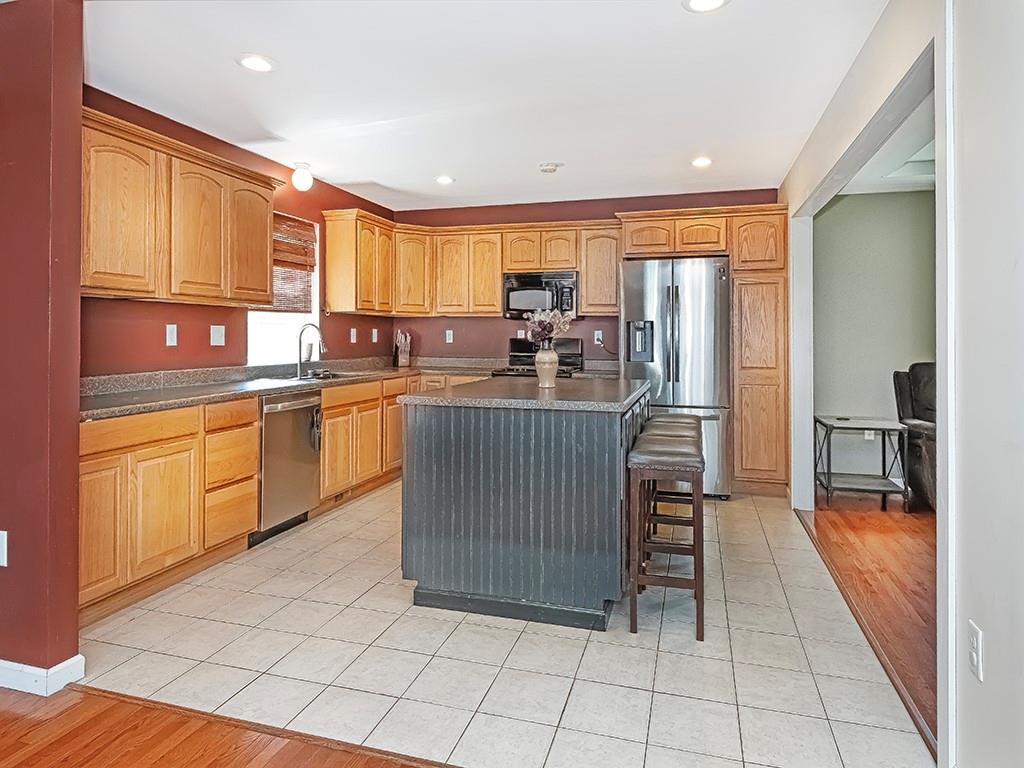 1928 Dime Road Vandergrift, PA 15690 - Photo 13 of 41 a kitchen with stainless steel appliances granite countertop a stove a sink and a refrigerator