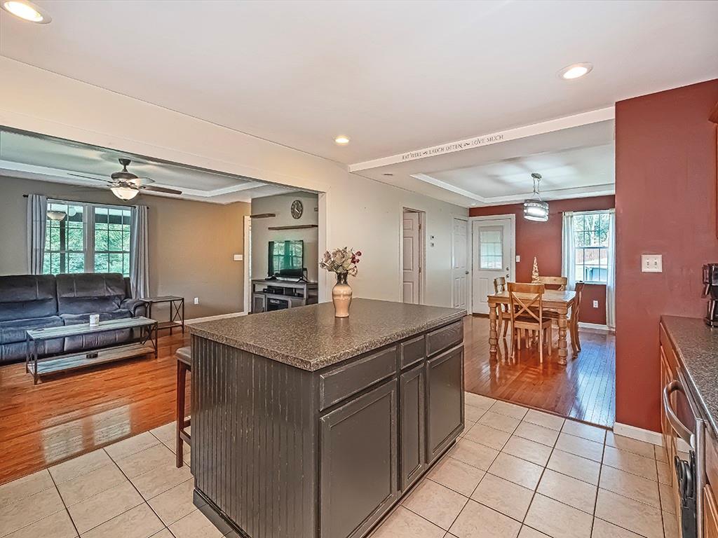 1928 Dime Road Vandergrift, PA 15690 - Photo 14 of 41 a kitchen with a counter top space a sink a stove and chairs