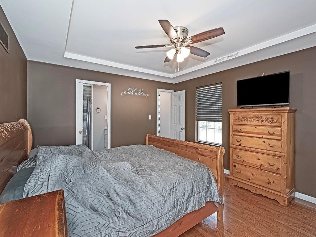 1928 Dime Road Vandergrift, PA 15690 - Photo 18 of 41 a bedroom with a bed a dresser and flat screen tv
