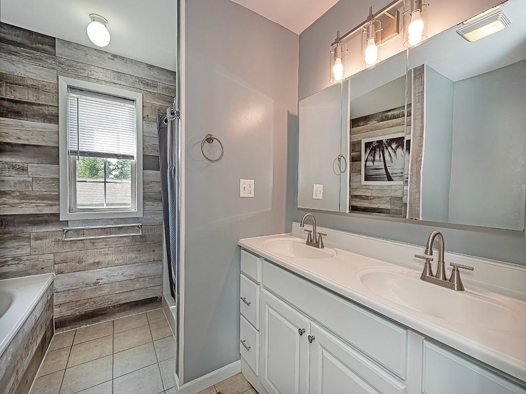1928 Dime Road Vandergrift, PA 15690 - Photo 20 of 41 a bathroom with a sink and a mirror