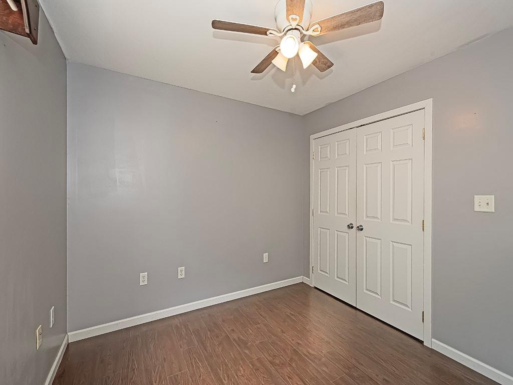 1928 Dime Road Vandergrift, PA 15690 - Photo 24 of 41 an empty room with wooden floor closet and chandelier fan