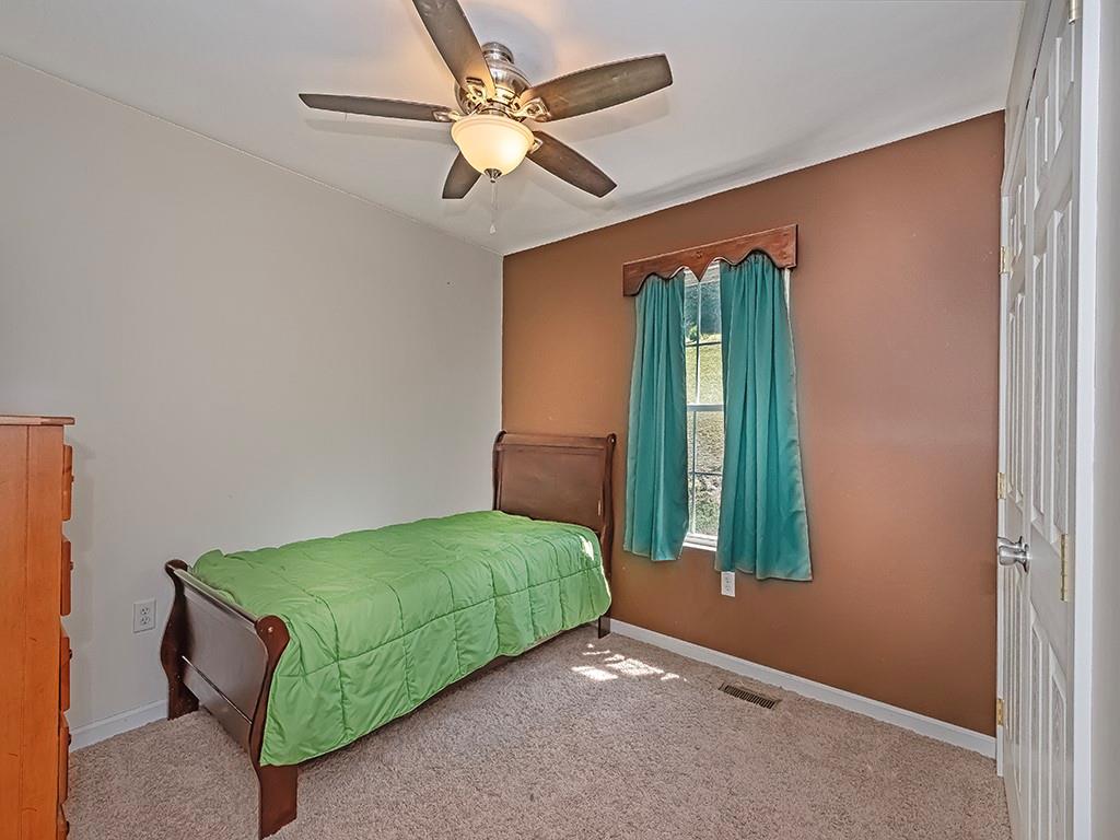 1928 Dime Road Vandergrift, PA 15690 - Photo 25 of 41 a living room with a bed furniture and a window