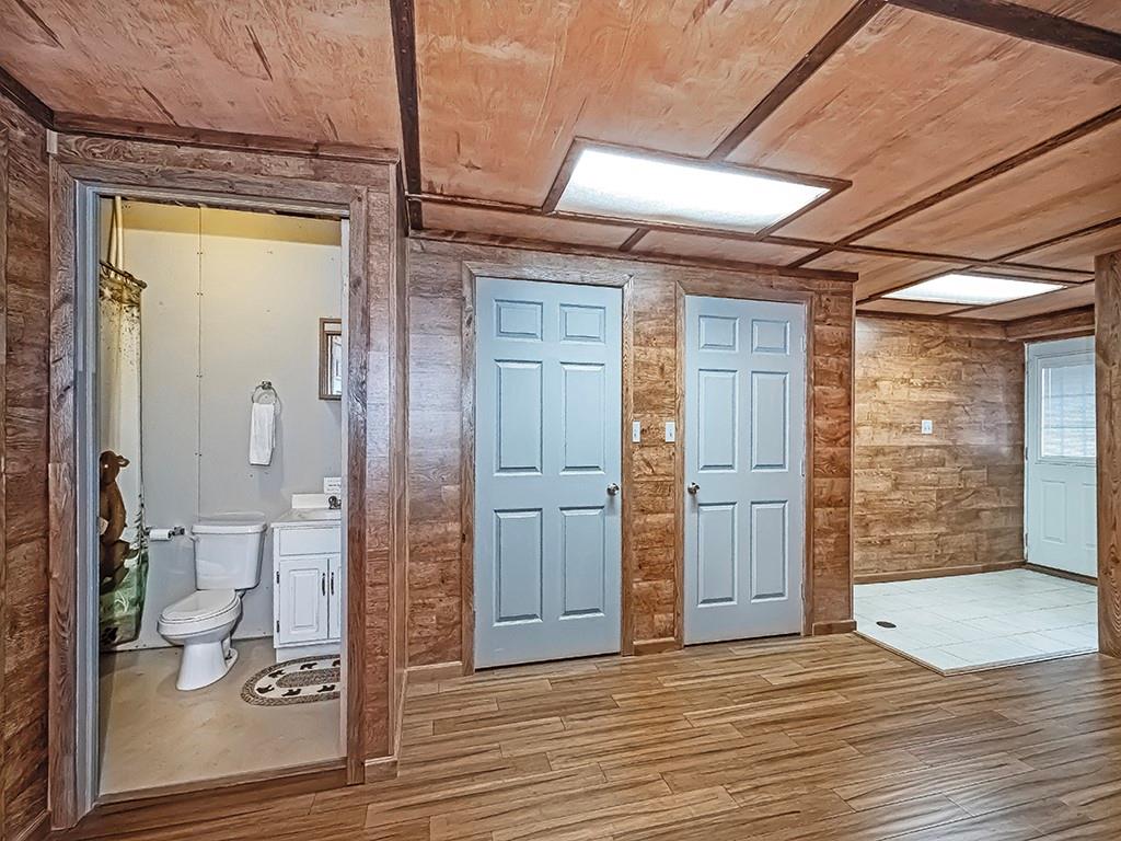 1928 Dime Road Vandergrift, PA 15690 - Photo 30 of 41 an empty room with wooden floor and way to kitchen
