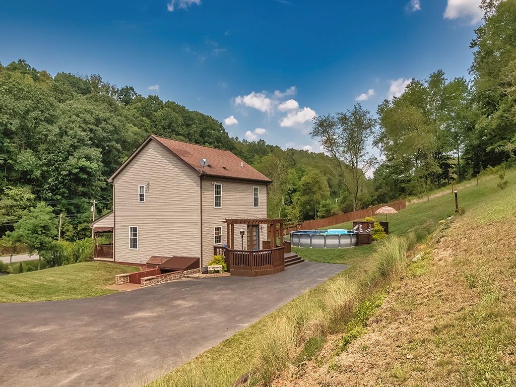 1928 Dime Road Vandergrift, PA 15690 - Photo 34 of 41 a view of a house with a yard