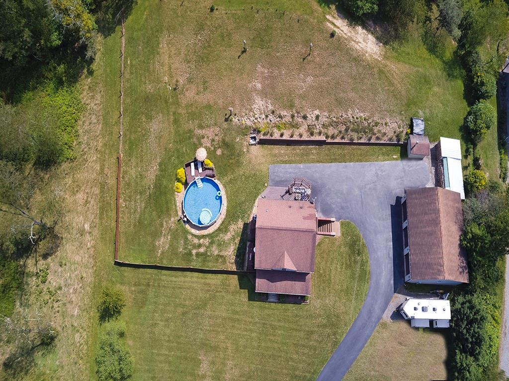 1928 Dime Road Vandergrift, PA 15690 - Photo 37 of 41 an aerial view of a house with swimming pool and large trees