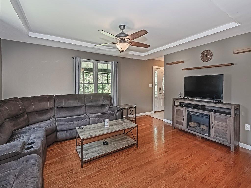 1928 Dime Road Vandergrift, PA 15690 - Photo 6 of 41 a living room with furniture and a flat screen tv
