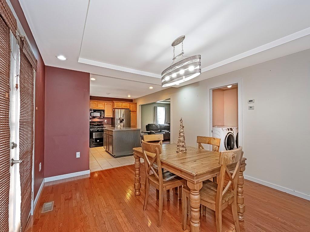 1928 Dime Road Vandergrift, PA 15690 - Photo 9 of 41 a view of a dining room with furniture and wooden floor