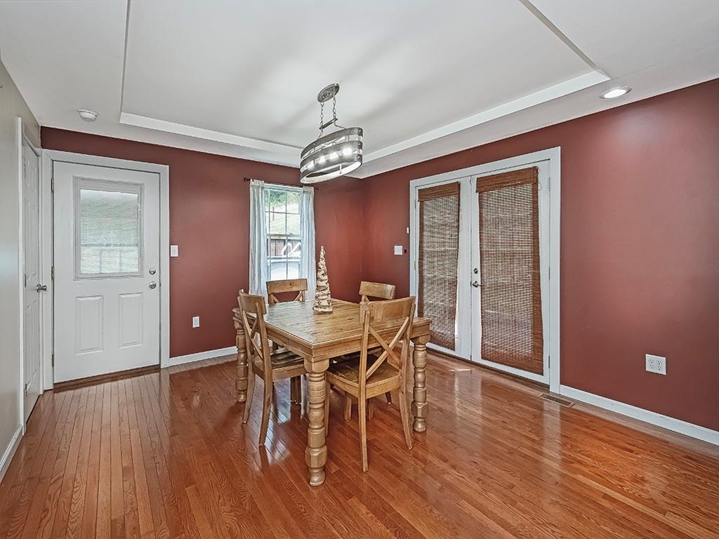 1928 Dime Road Vandergrift, PA 15690 - Photo 10 of 41 a view of a dining room with furniture window and wooden floor